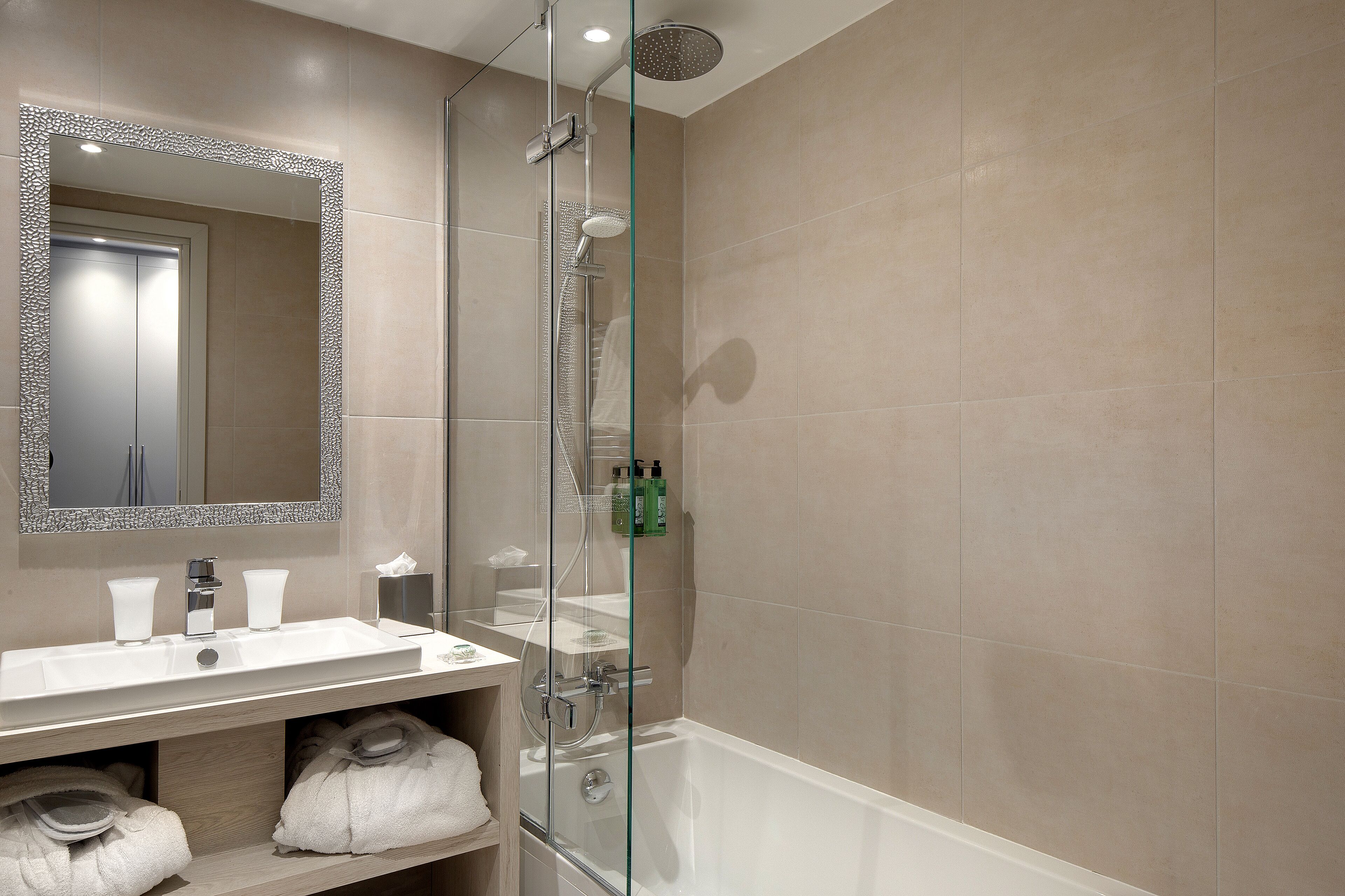 designer toiletries, hair dryer, bathrobes, slippers