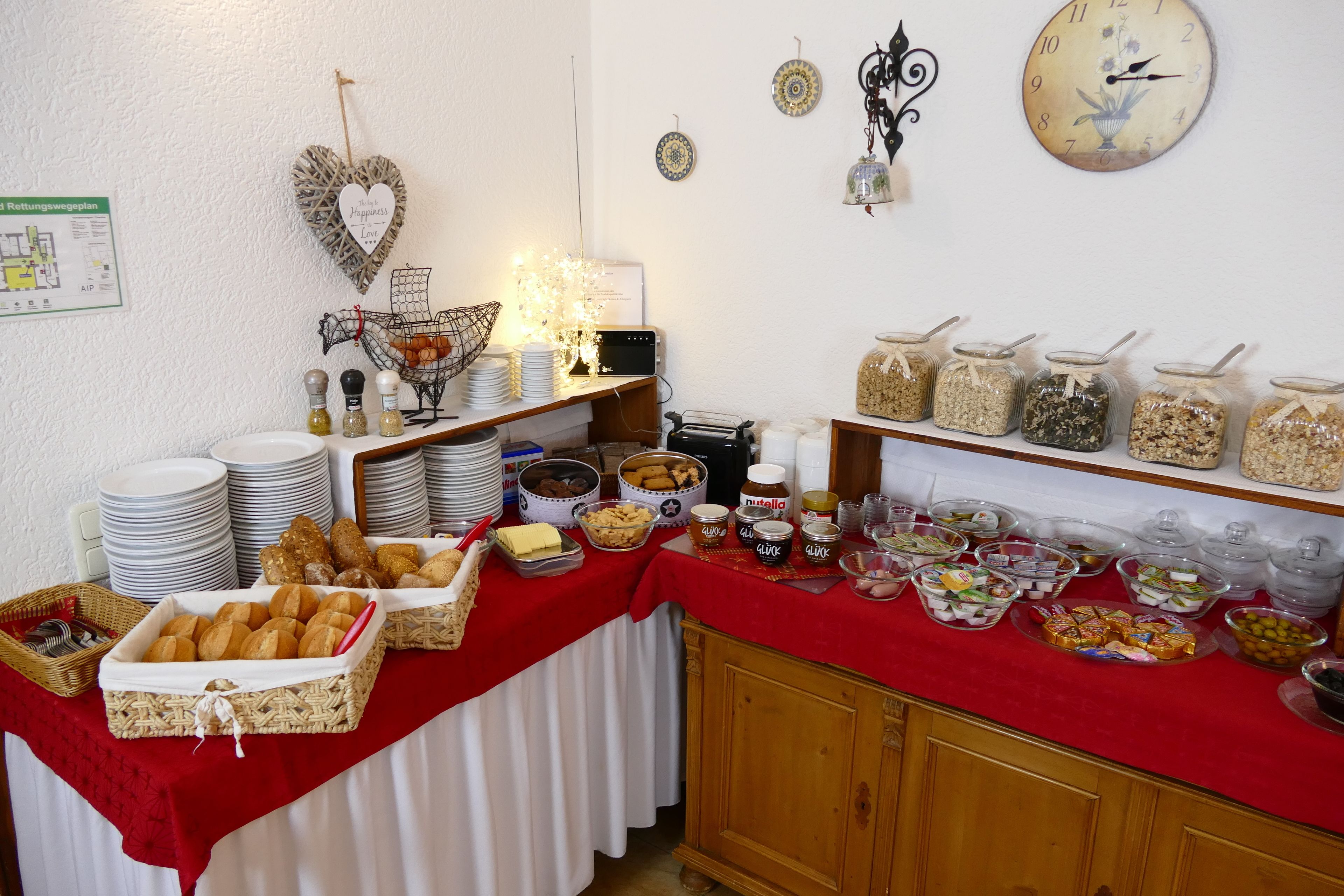 A buffet setup with various food items and condiments.