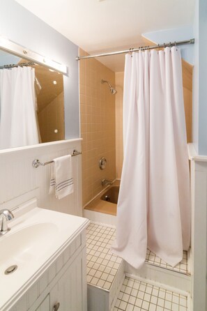 Combined shower/tub, hair dryer, towels, soap