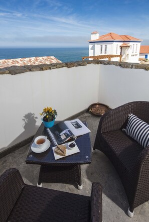 Suite Deluxe, 1 cama Queen size, vista al mar (Suite Buzios) | Caja de seguridad en la habitación, wifi gratis y ropa de cama 