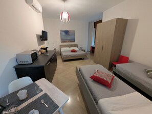 Quadruple Room Multiple Beds, Private Bathroom | Premium bedding, down comforters, minibar, in-room safe - Napoli City Inn (Naples)