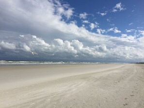 On the beach, sun-loungers, beach towels