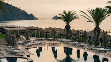 4 outdoor pools, open 9:00 AM to 6:00 PM, pool umbrellas, sun loungers