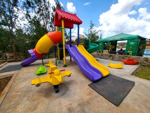 A playground with slides and climbing structures.