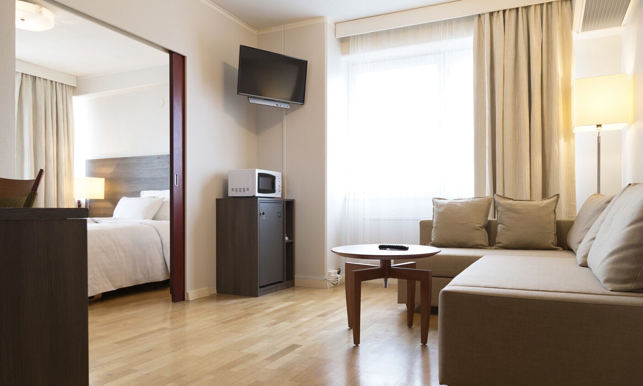 junior suite, 1 king bed with sofa bed, non smoking, sauna | 1 bedroom, desk, laptop workspace, blackout curtains