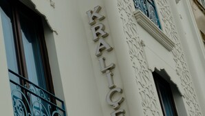 A building facade with ornate metal railings and a sign that reads "KRANTICE." - Hotel Kralice (Istanbul)