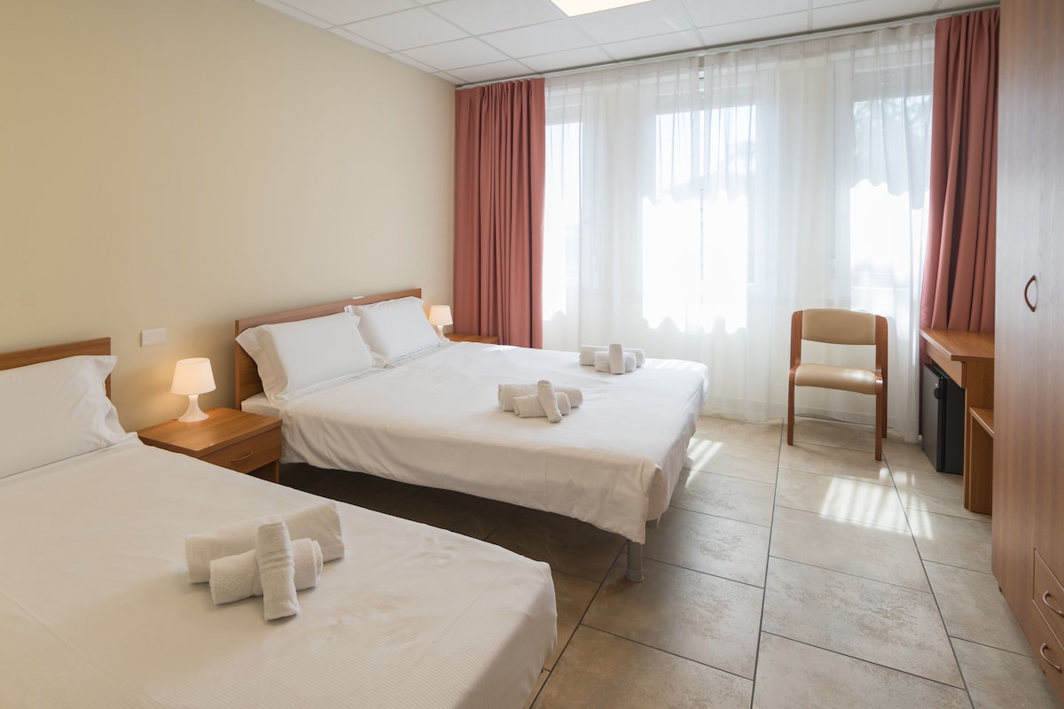 Triple Room | Down comforters, desk, laptop workspace, blackout drapes