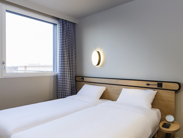 Studio, 2 Twin Beds | In-room safe, individually decorated, laptop workspace, blackout drapes