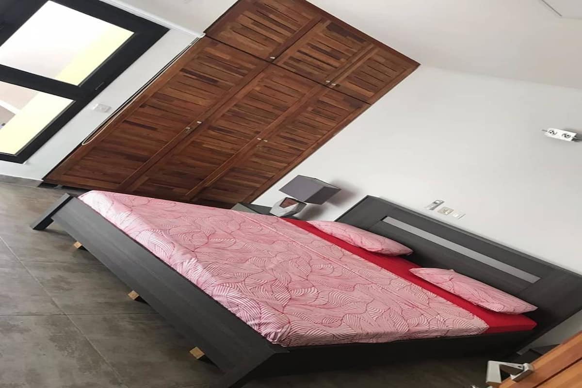 Premium bedding, blackout curtains, iron/ironing board, bed sheets