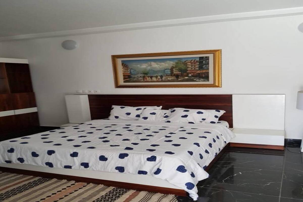 Premium bedding, blackout curtains, iron/ironing board, bed sheets