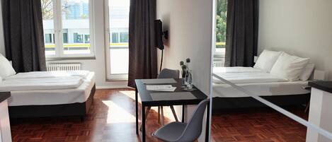 Hypo-allergenic bedding, laptop workspace, blackout curtains
