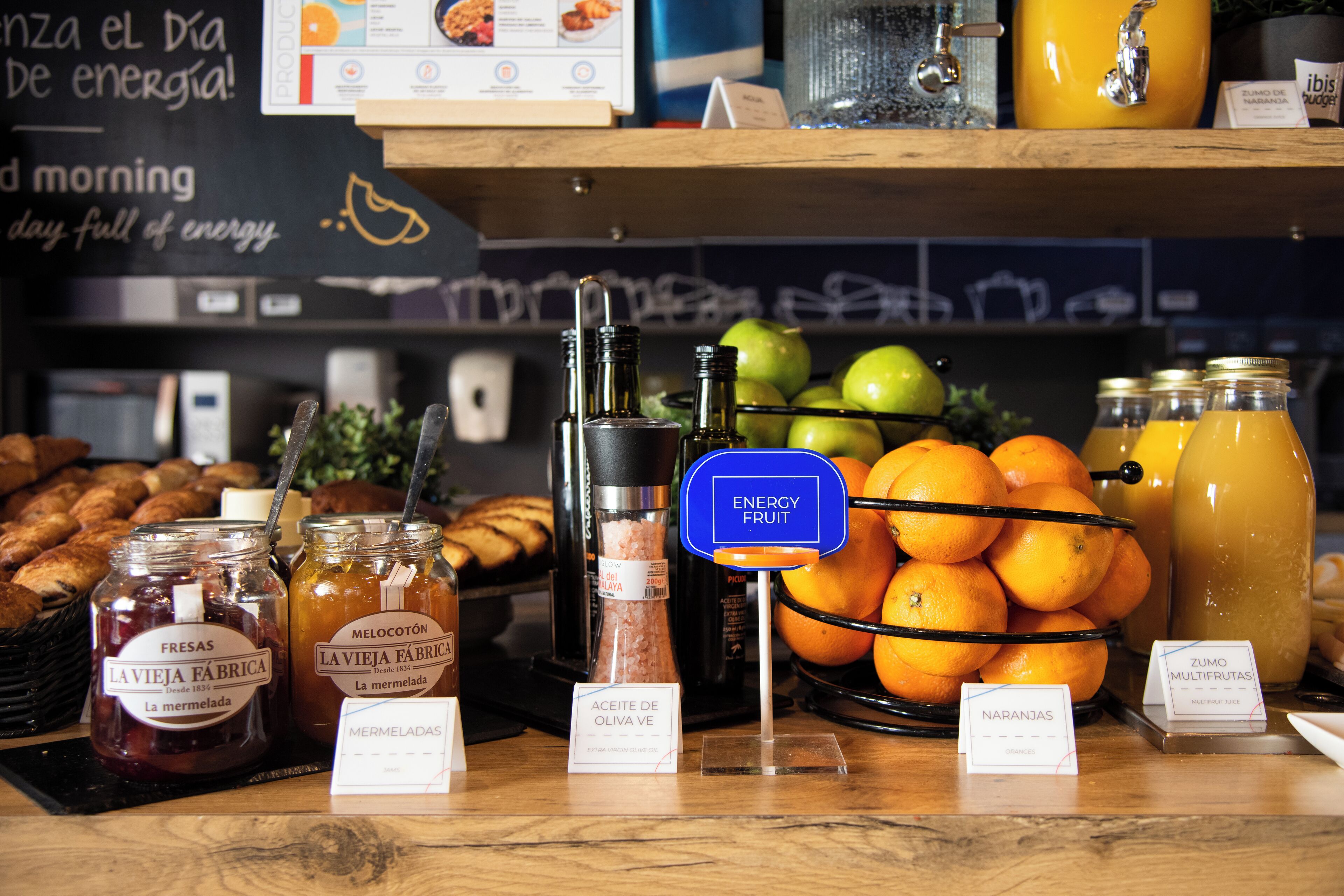 A breakfast buffet with various food items and beverages.