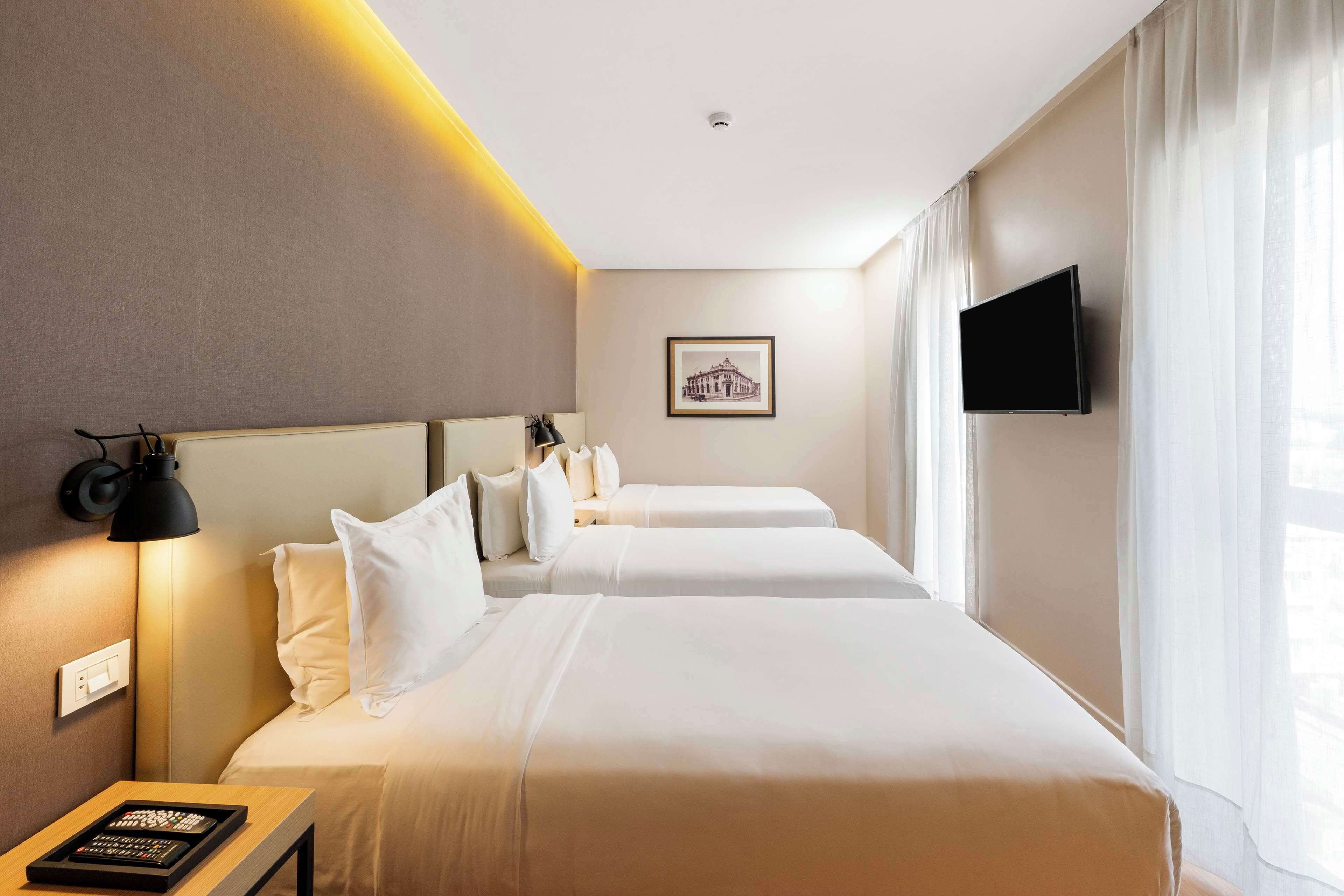 room, 3 single beds | minibar, in-room safe, desk, laptop workspace