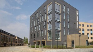 A modern hotel building with a flat roof, multiple windows, and a clean, urban design. - Sunley Hotel (Northampton)