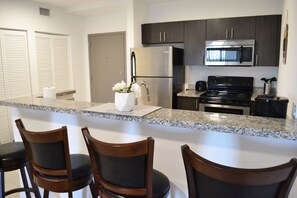 Hypo-allergenic bedding, iron/ironing board, cots/infant beds