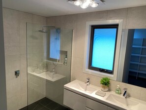 Bathtub, hair dryer, towels, soap