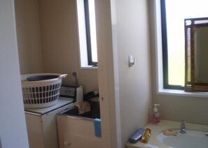 Shower, hair dryer, towels, toilet paper