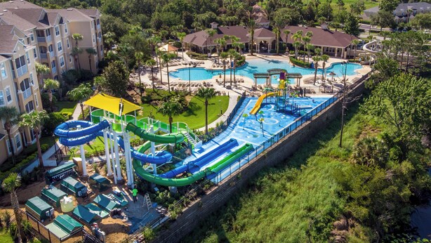 A resort with multiple swimming pools, a water park, and a variety of accommodations.