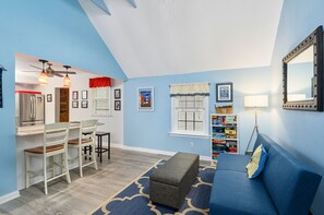 Flat-screen TV, DVD player, books