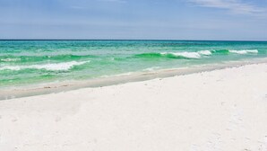 A beach with clear turquoise water and white sand. - Crystal Vista with Private Pool, Gulf Views, and Beach Chair Setup (Destin)