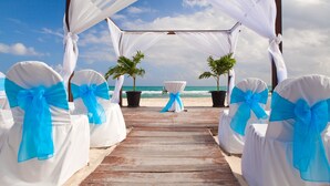 A wooden pier leading to a white canopy with blue sashes, overlooking the sea. - Crystal Vista with Private Pool, Gulf Views, and Beach Chair Setup (Destin)