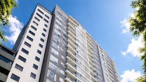 A high-rise residential building with multiple balconies, large windows, and a modern architectural design. - Miraflores Nest - Upper Pardo (Miraflores)