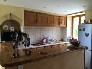 Enjoy cooking in this well-equipped kitchen with a microwave, coffee maker, and refrigerator.