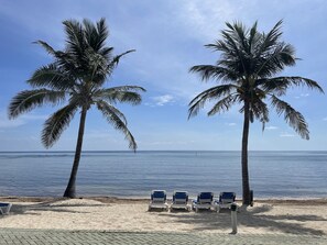 On the beach, sun loungers, beach towels