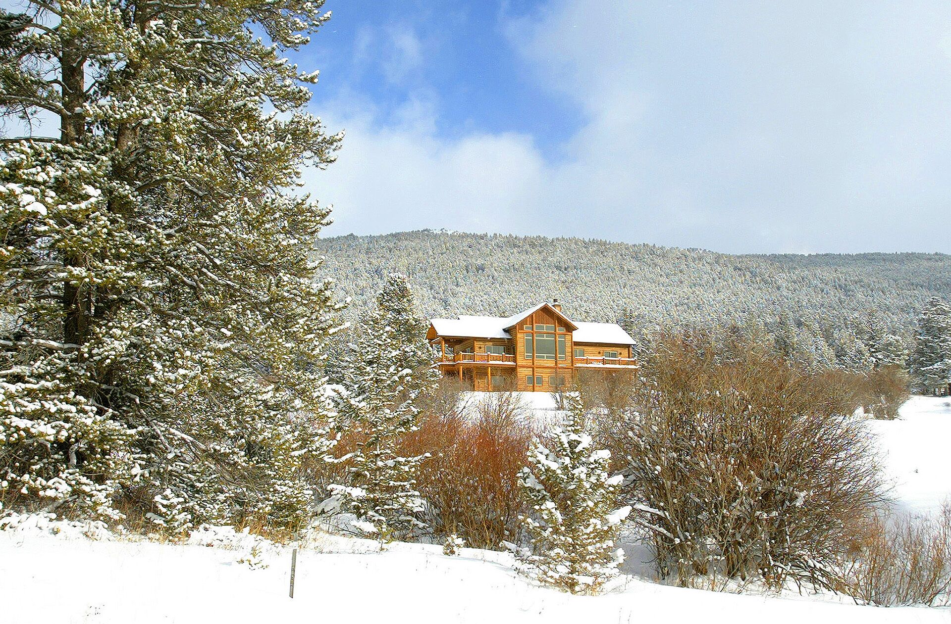 winter view fo Bridger Vista Lodge looking east from Bridger Canyon Rd