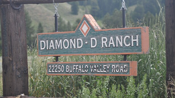 A rustic wooden sign with the text "DIAMOND D RANCH" and "22250 BUFFALO VALLEY ROAD". - Cute 2/1 Cabin With Full Kitchen And Teton Views (Moran)