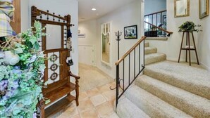 A staircase with a wooden handrail and a metal railing, leading to an upper floor. - Rio Del Mar Aptos-two blocks to the Sand, Ocean, Store, Restaurant, Coffee shop (Aptos)