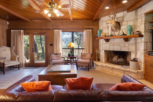 Jump right in the river at this gated, 2 acre Guadalupe Riverfront home!