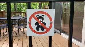 A sign with a bear symbol crossed out, indicating no bears allowed.