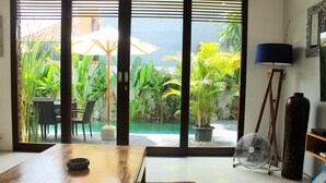 Deluxe Villa, 3 Bedrooms | Living area | 50-cm LCD TV with cable channels, TV - Bintang Baru Private Villa Sanur (Denpasar)