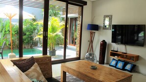 Deluxe Villa, 3 Bedrooms | Living room | 50-cm LCD TV with cable channels, TV - Bintang Baru Private Villa Sanur (Denpasar)