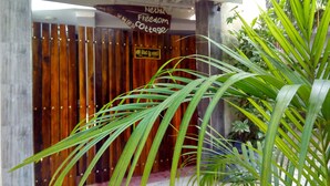 A wooden fence with a sign that reads "Nethu Freedom Cottage." - Nethu freedom cottage (Ahangama)