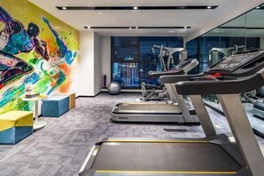 Stay fit and energized with our fully equipped gym, featuring treadmills and weight machines, and enjoy a city view.