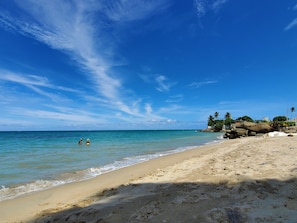 On the beach, sun loungers, beach towels