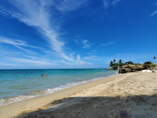 On the beach, sun loungers, beach towels
