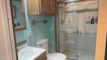 Shower, towels, soap, toilet paper