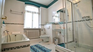 Bathtub, hair dryer, towels, soap
