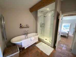 Bathtub, hair dryer, towels, soap