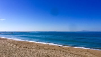 On the beach, sun-loungers, beach towels