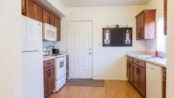 Coffee/tea maker, paper towels, dining tables