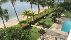 A resort with a pool, beach, and palm trees. - Romantic Oceanfront Condo at Lahaina Shores with Sweeping Ocean Views (Lahaina)