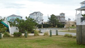 A residential area with houses, a playground, and a sandy beach. - Beautiful and Spacious, 2 bed 2 full bath, pool and jacuzzi, steps to the ocean (Hatteras)