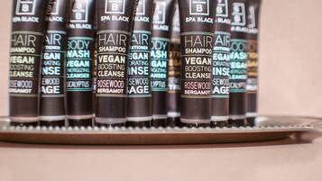 A row of hair care products on a shelf.