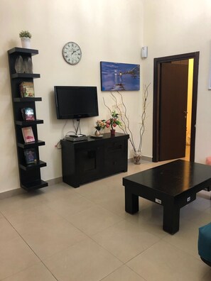 Premium Apartment, 2 Bedrooms, City View | Living room | Flat-screen TV - Unique TLV Bauhaus (Tel Aviv)