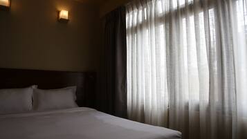 Premium bedding, down comforters, blackout drapes, free WiFi