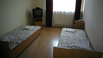 Economy Double or Twin Room, Courtyard View | Blackout drapes, free WiFi, bed sheets